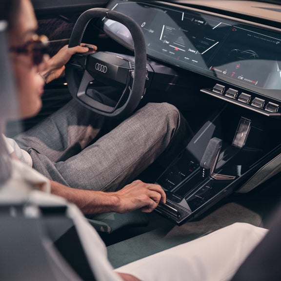 Driver and passenger in the Audi skysphere concept in “Sports” mode.