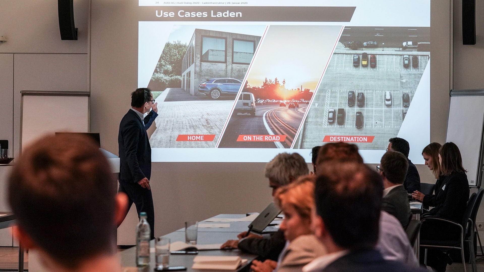 Man gives presentation on charging infrastructure for electric cars
