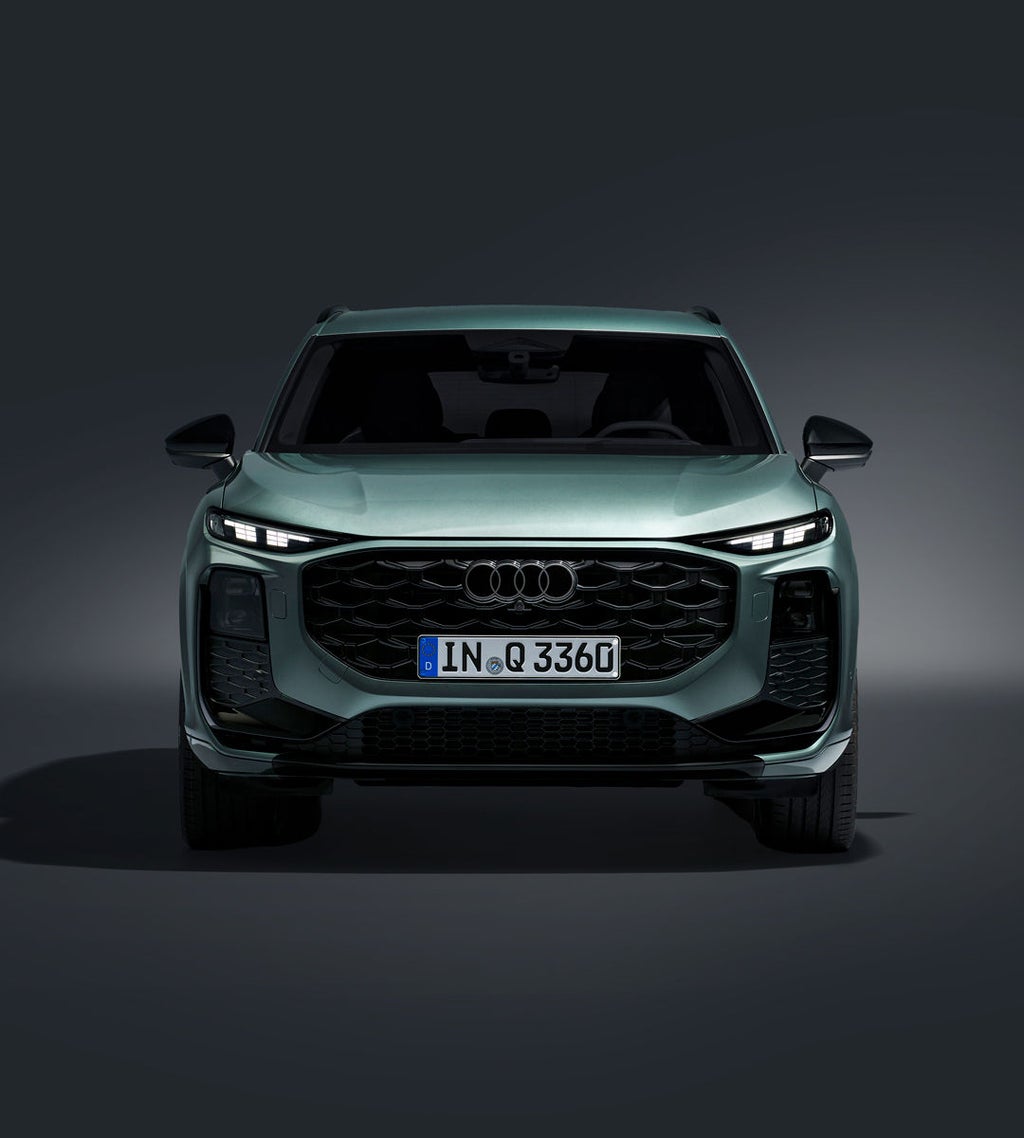 The Q3 SUV in front view with focus on the large Audi single-frame grille.