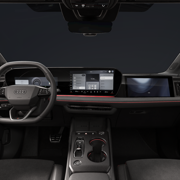 Nahaufnahme des Cockpits mit Fokus auf das abgeflachte Lenkrad, das geschwungene Panoramadisplay und das Beifahrerdisplay.