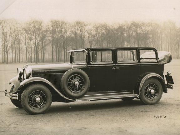 Sepia photo of the Audi Type R Imperator in front of a row of trees