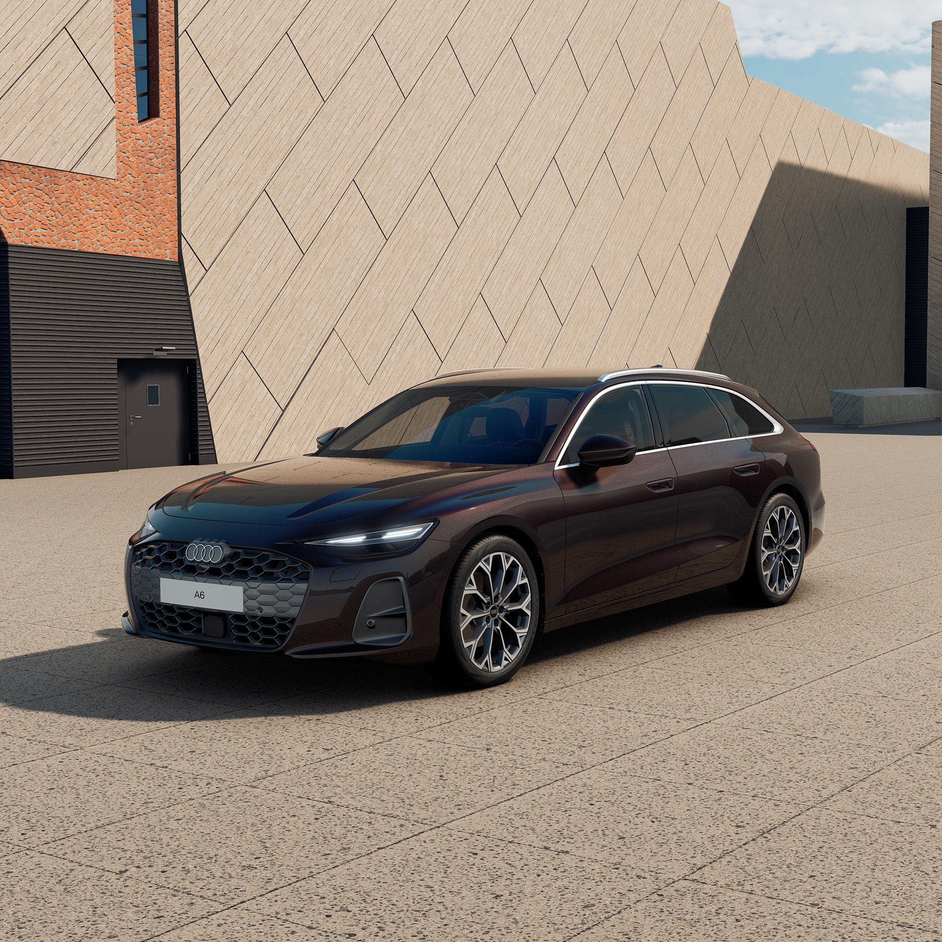 Audi A6 Avant seitlich vor einem moderenen Gebäude