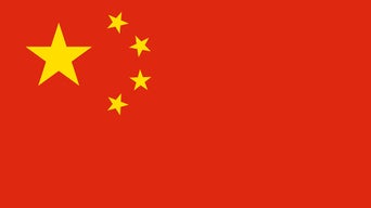 Flag of China with a red background and five yellow stars in the upper left corner.