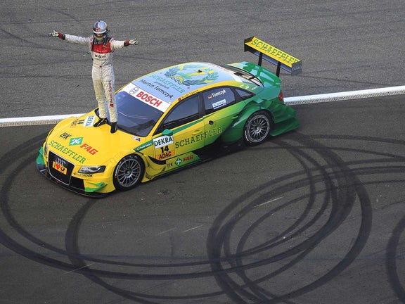 A picture of Martin Tomczyk celebrating his DTM title at Hockenheim in 2011.