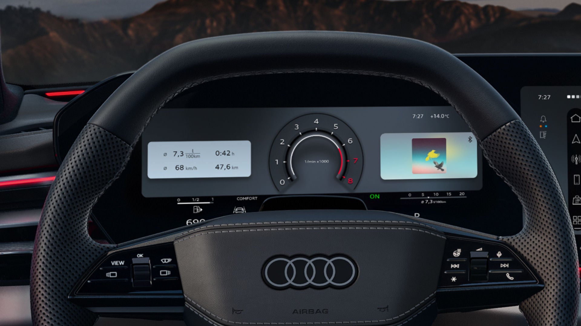 View of the A6 Avant's steering wheel and driver display from the driver's perspective.