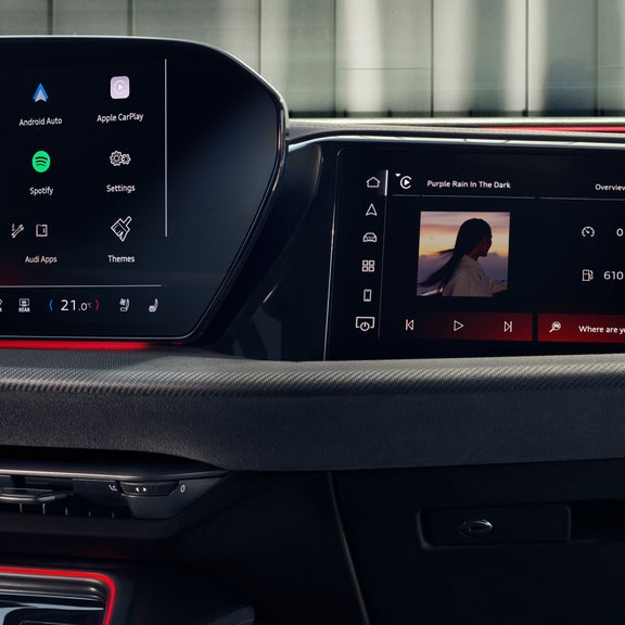 Car infotainment screen displaying radio, media, phone, and navigation options.