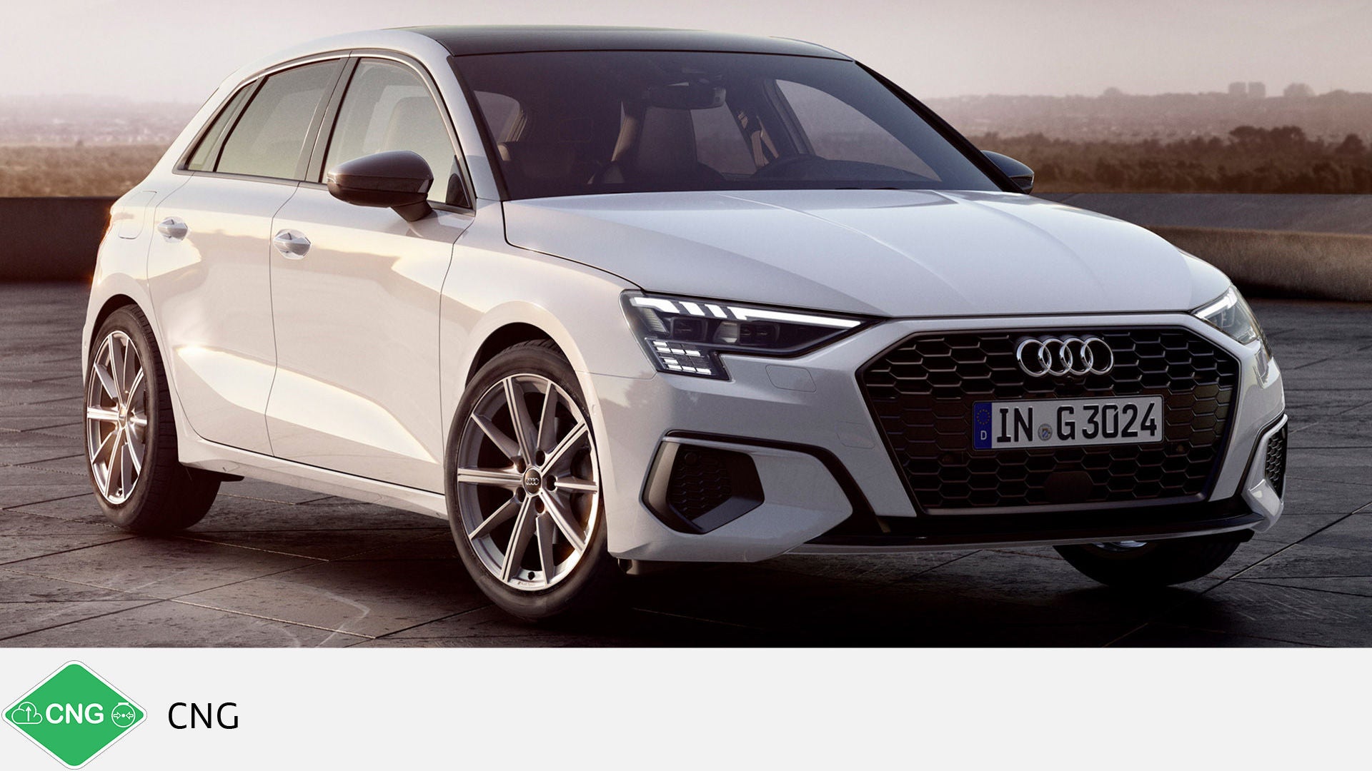 White Audi A3 Sportback g-tron on the roof terrace at sunset. Green CNG symbol with text at the bottom.