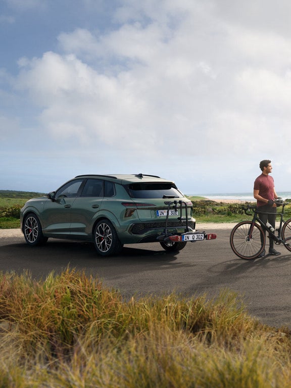 Audi Q3 SUV AOZ rear view with bike rack and people in front of it