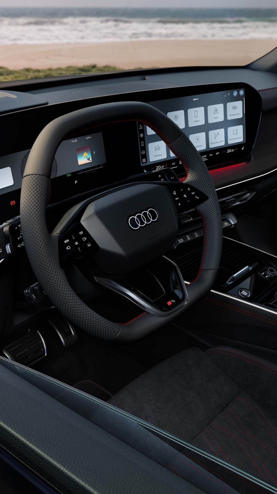 Das Interior des Q3 Sportback mit Lenkrad, Panoramadisplay und rotem Ambiente-Lichtpaket.