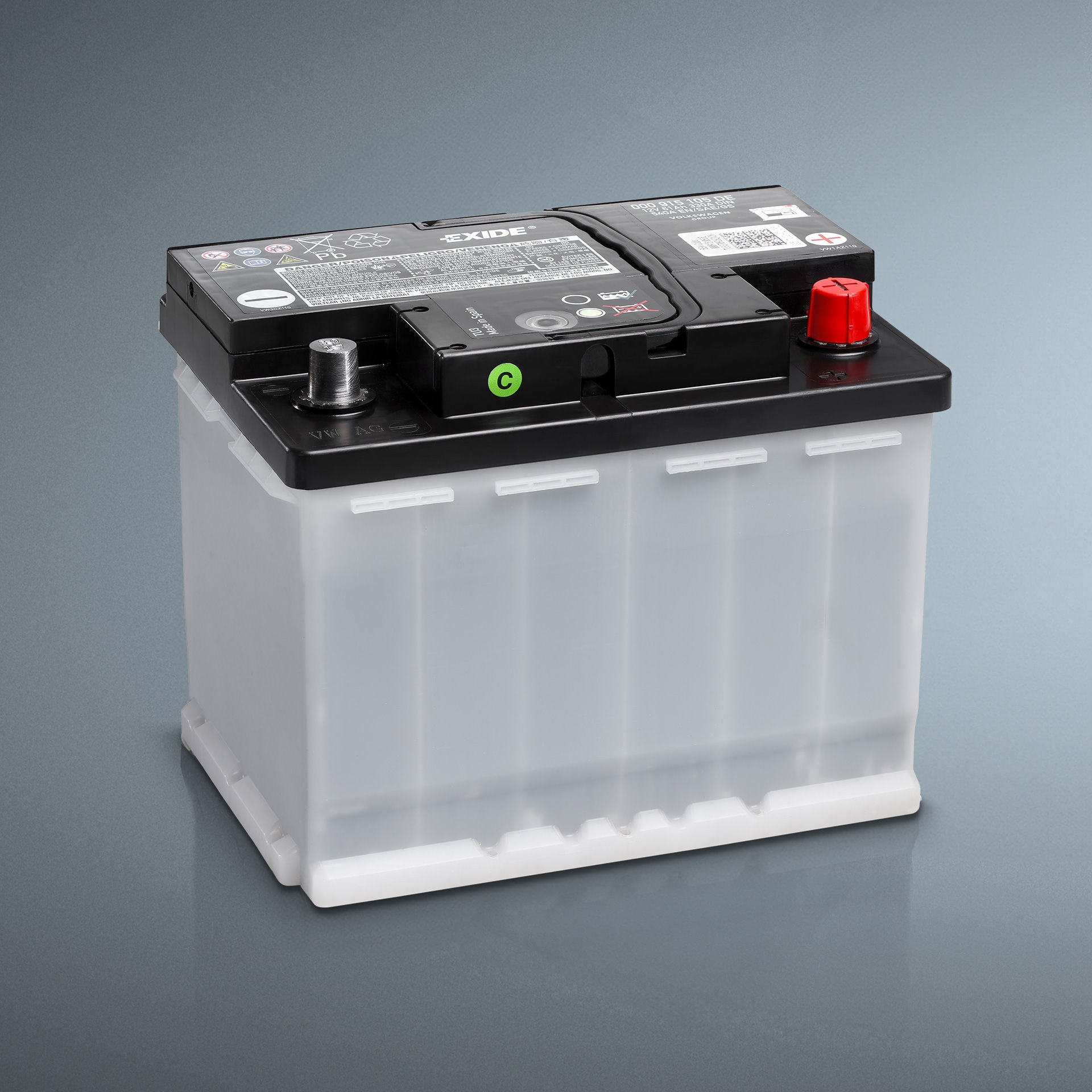 Nassbatterie mit transparentem Gehäuse und schwarzem Deckel auf grauem Hintergrund.