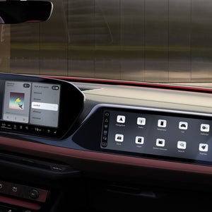 Close-up of the front passenger display in the cockpit of the S5 Avant. A strip of red ambient light glows beneath the windshield.