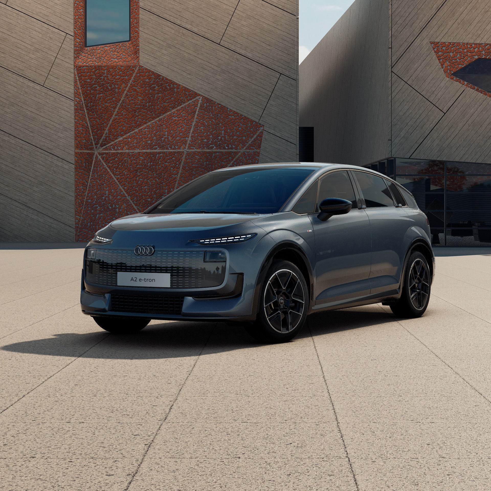 Ein Audi A2 e-tron in Horizontblau Metallic schräg von vorne fotografiert vor einer futuristischen Kulisse