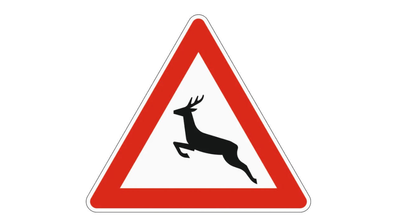 Verkehrsschild „Wildwechsel“ mit springendem Hirschsymbol in rotem Dreieck auf weißem Hintergrund.