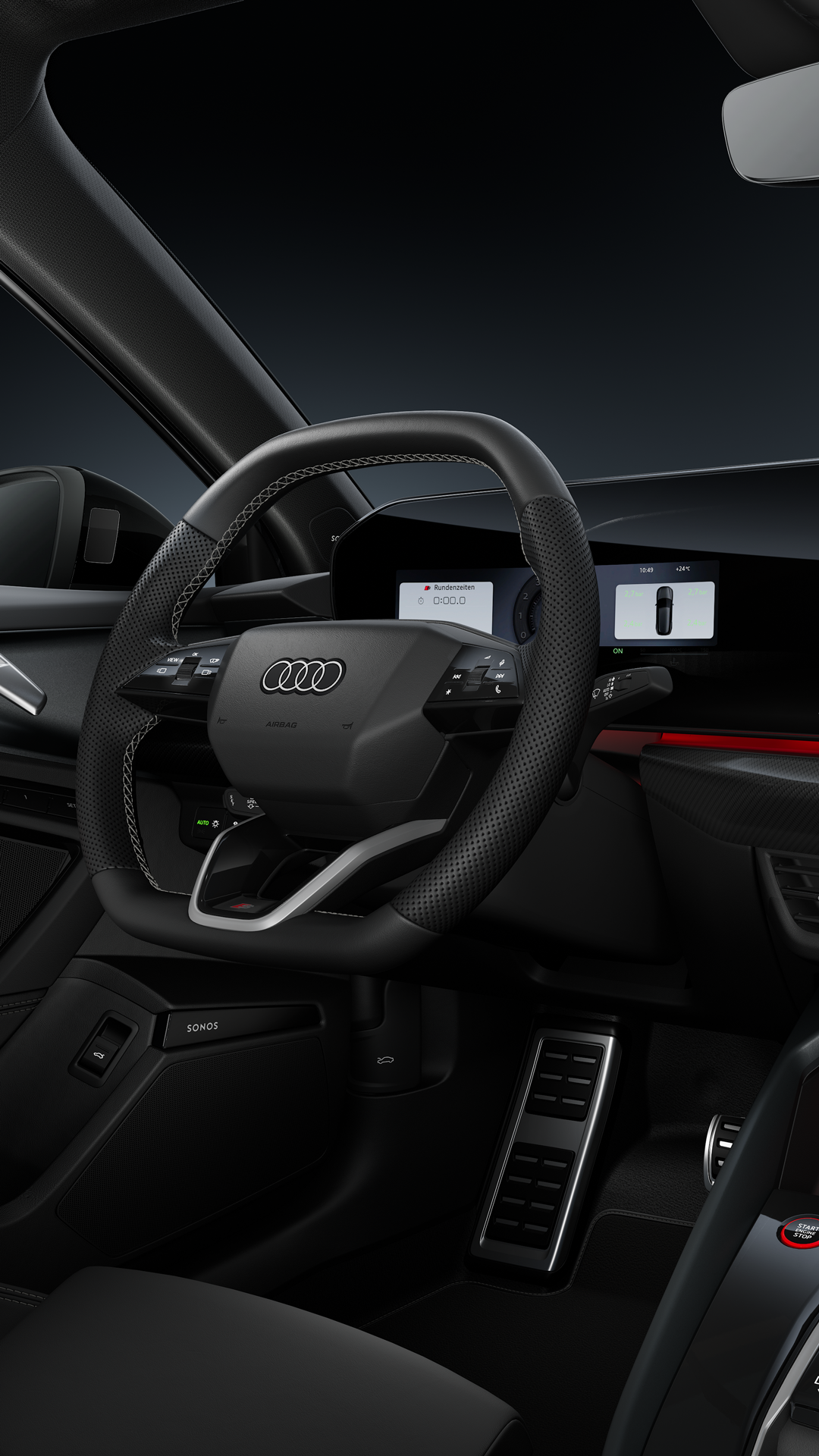 Blick auf das Cockpit mit Fokus auf das Sportlederlenkrad und das geschwungene Panoramadisplay.