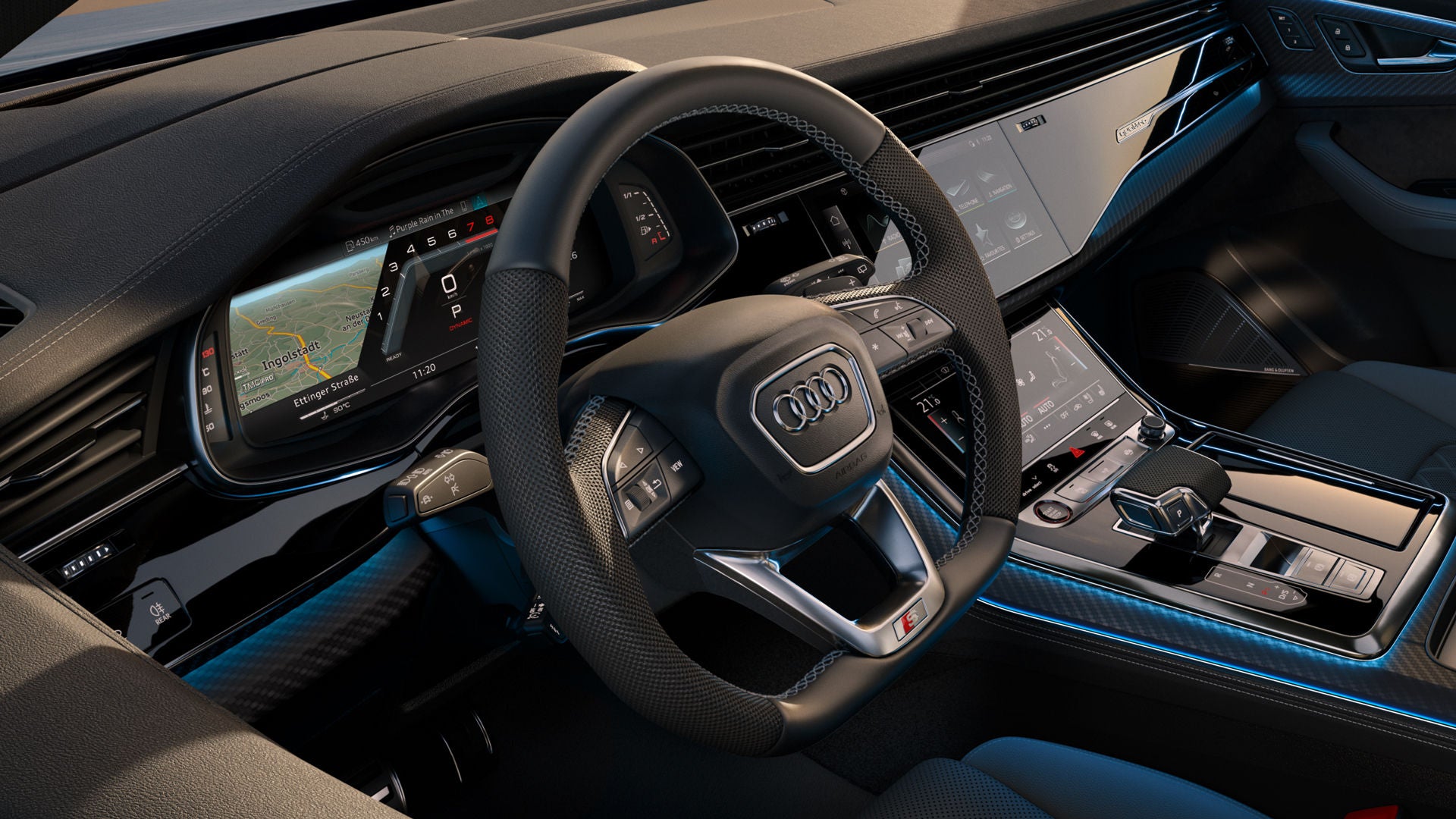 Kijkje in de cockpit van de SQ8 SUV vanaf de bestuurderszijde, met de nadruk op het stuur en de digitale displays.