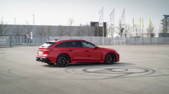 A still image of the Audi RS 5 Avant in a parking lot