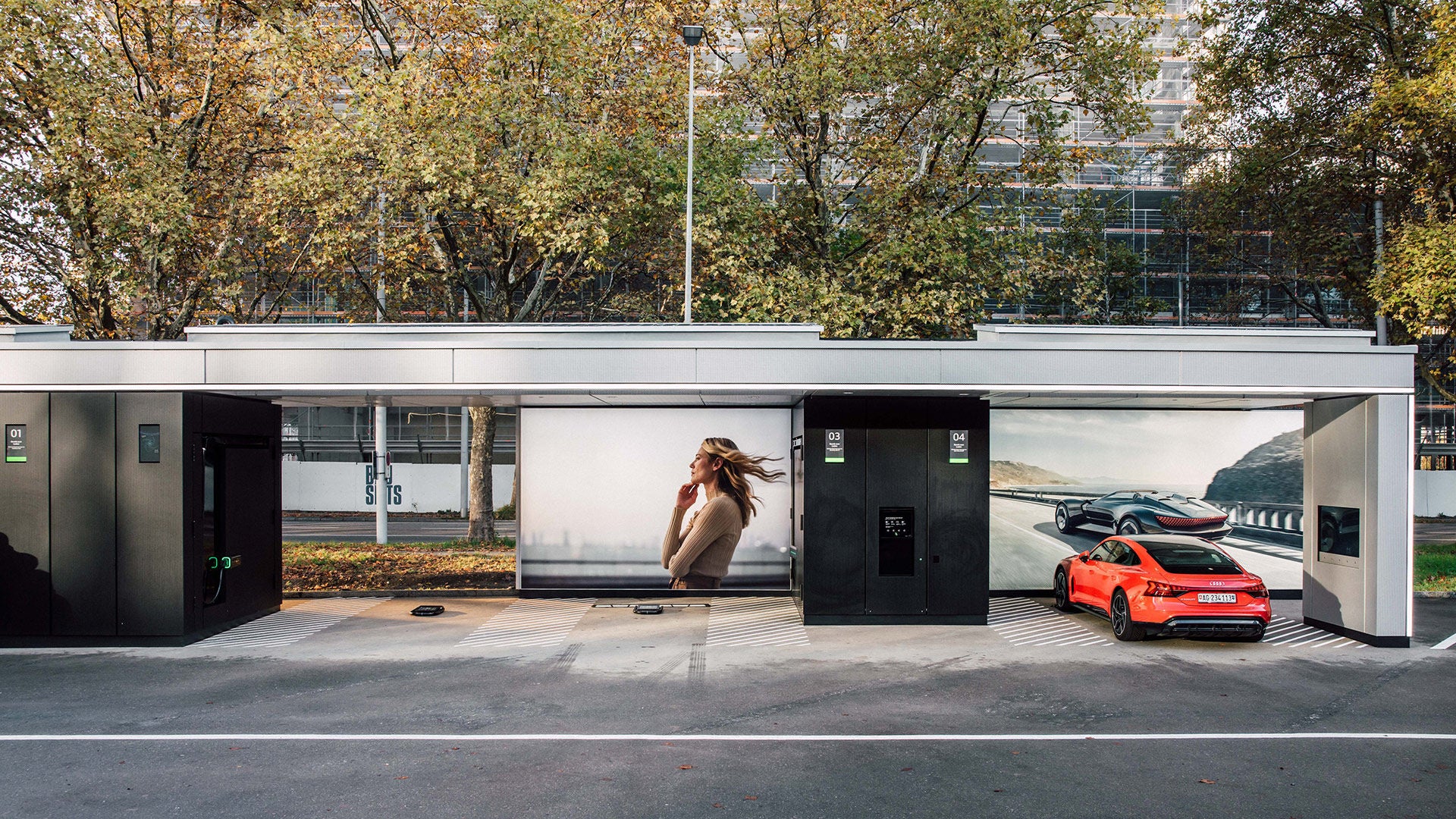 Red Audi e-tron GT quattro charging at the Audi Charging Hub Zurich