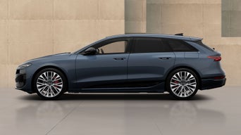 metallic A6 avant besides a beige stone modern wall