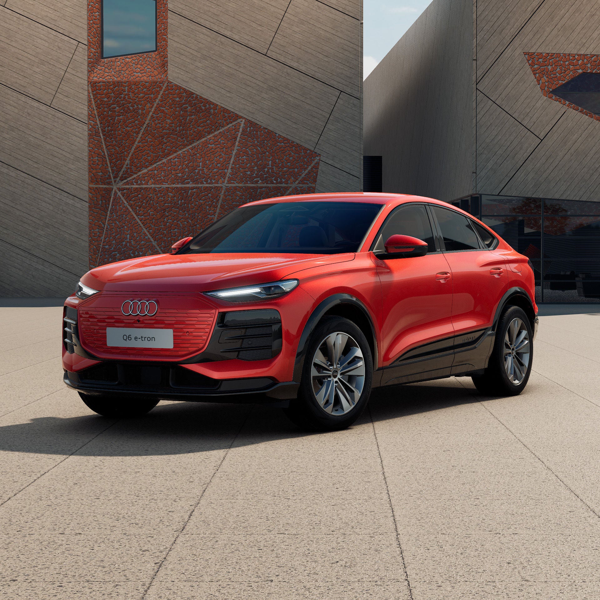 Q6 Sportback e-tron vor einem modernen Gebäude