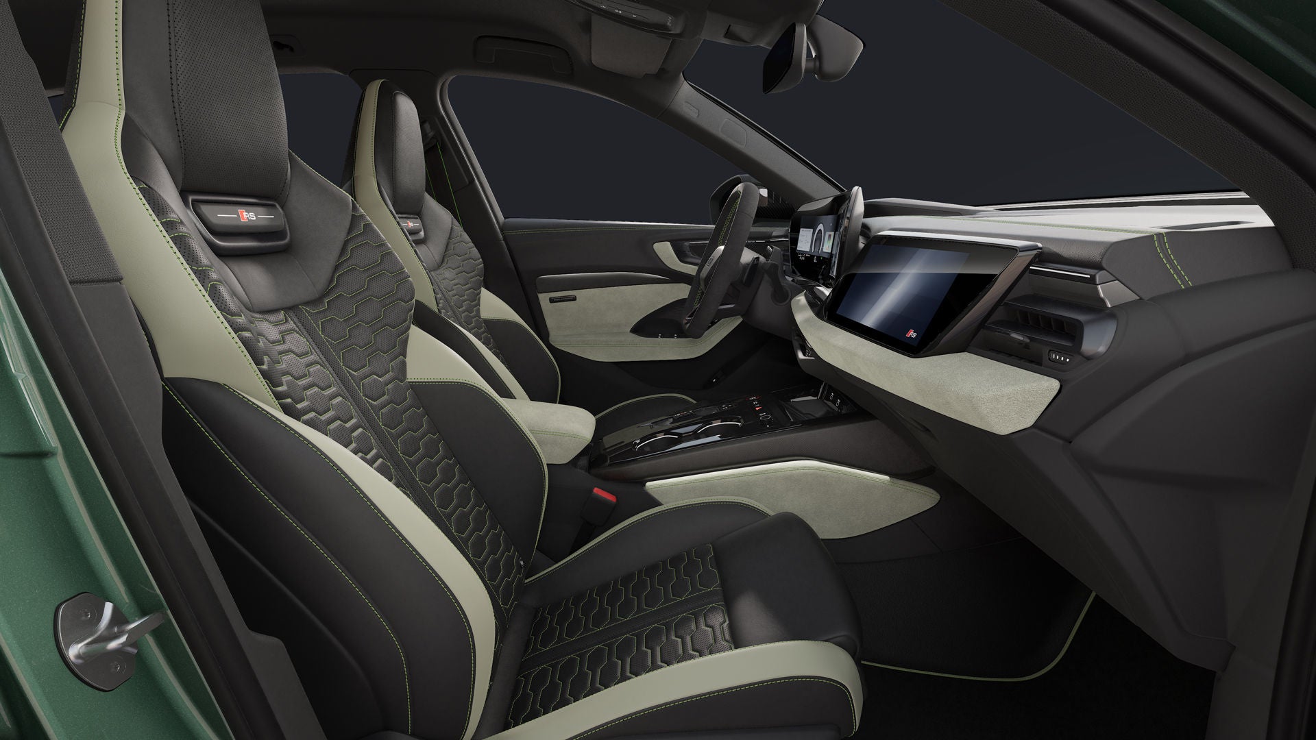 View from the passenger side of the cockpit of the RS 5 Sedan, featuring sports seats in black/ginger white leather combination with honeycomb quilting and iguana green contrast stitching.