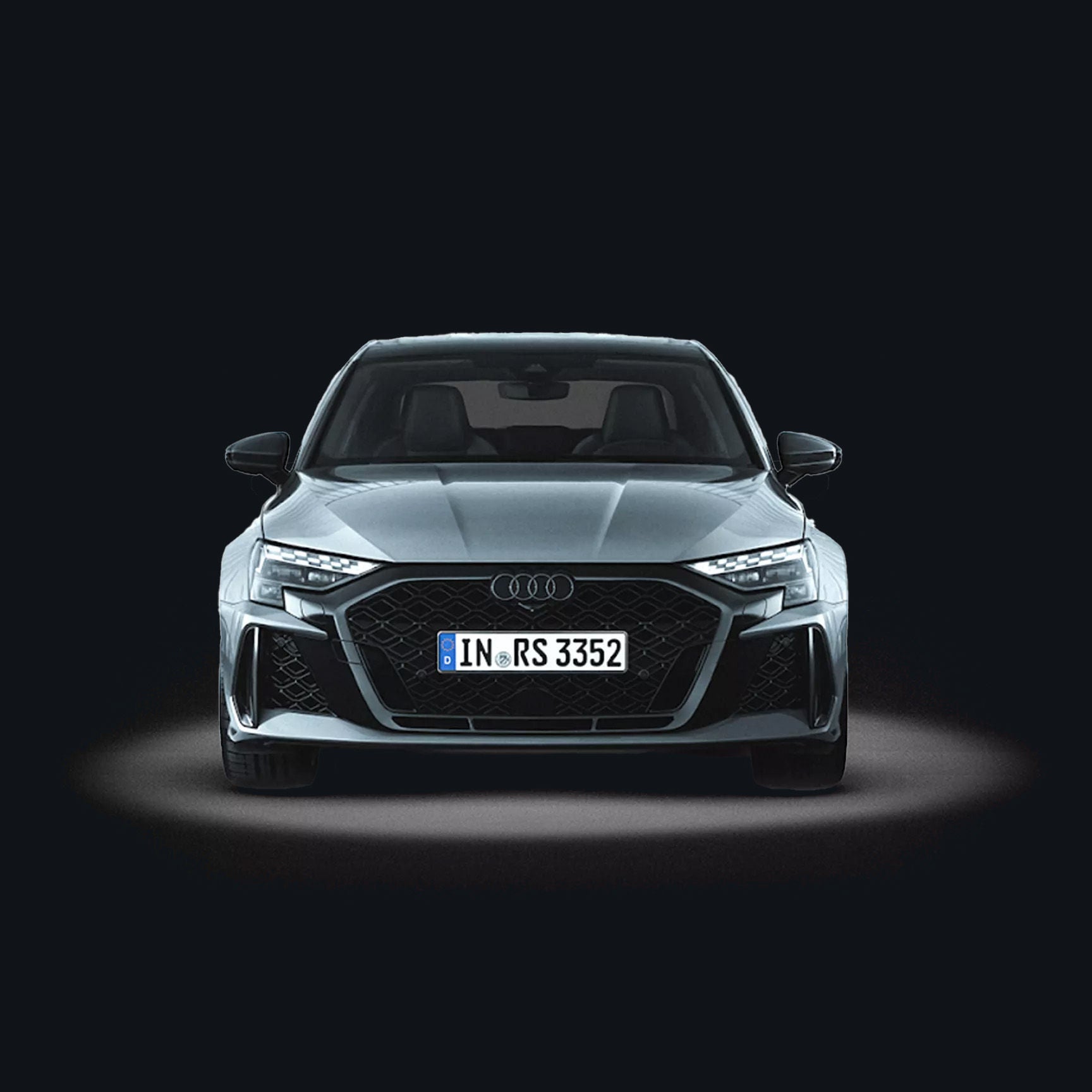 An Audi RS 3 saloon facing head on against white plain background