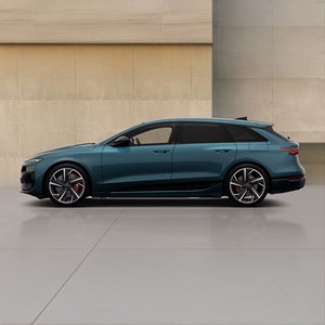 Left side of a green S6 Avant e-tron performance Audi vehicle