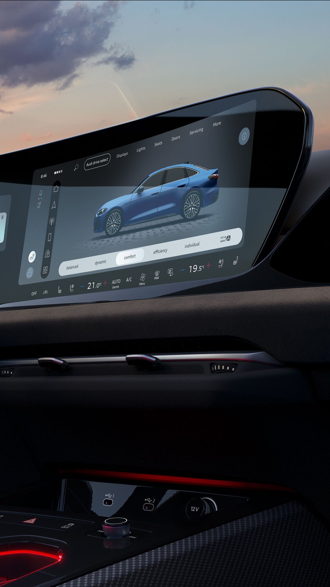 Interior and cockpit of the S5 Avant from the front passenger's perspective. The interior is illuminated by orange ambient lighting. 