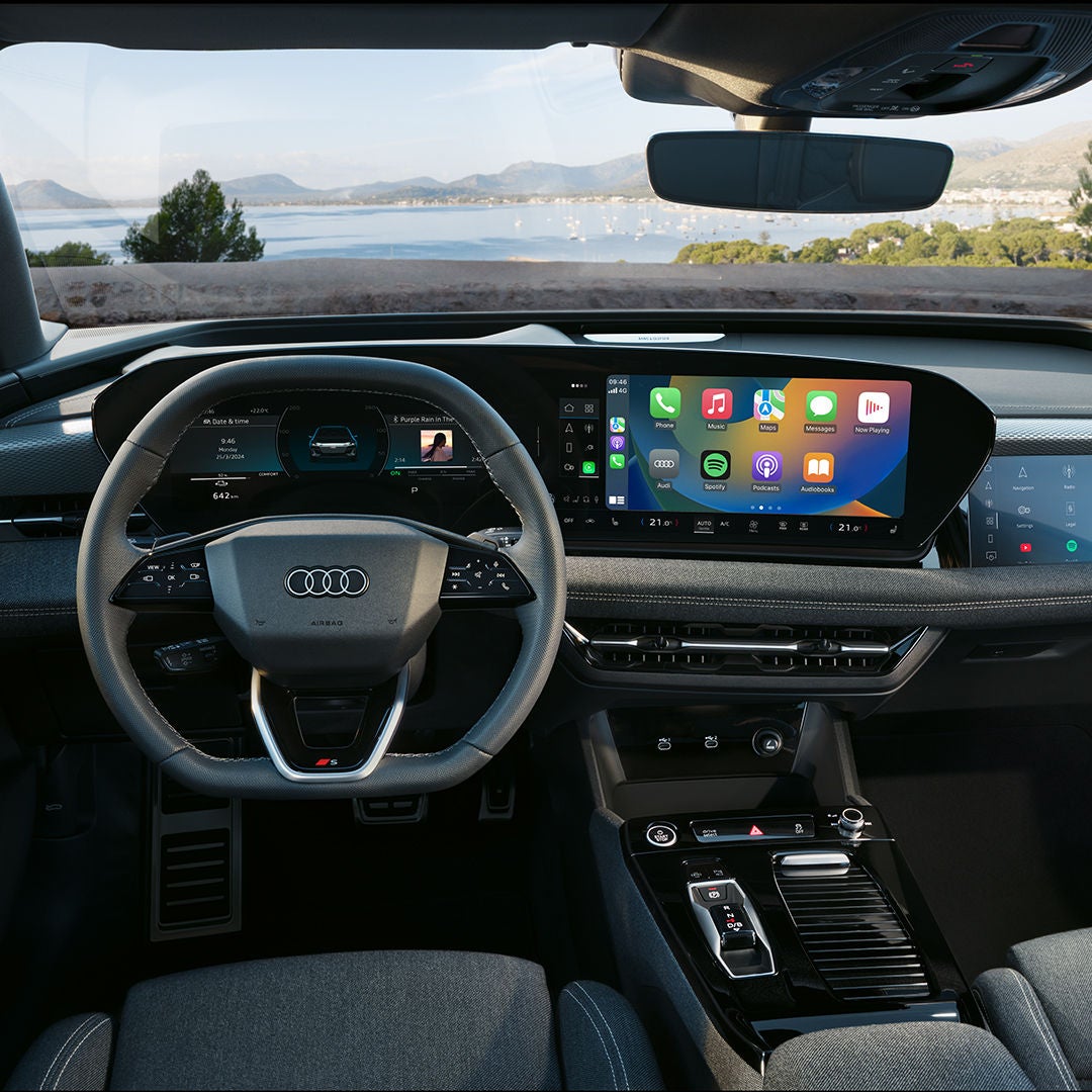 Someone dials something on the Touch display in a car