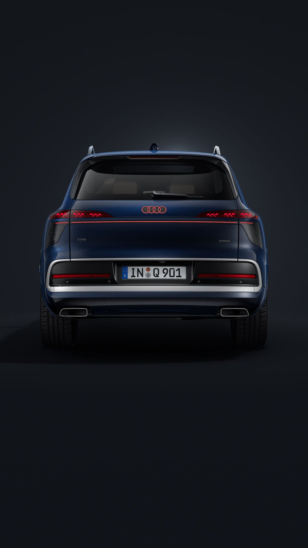 Der Audi Q9 SUV schräg von vorne auf dunklem Hintergrund.