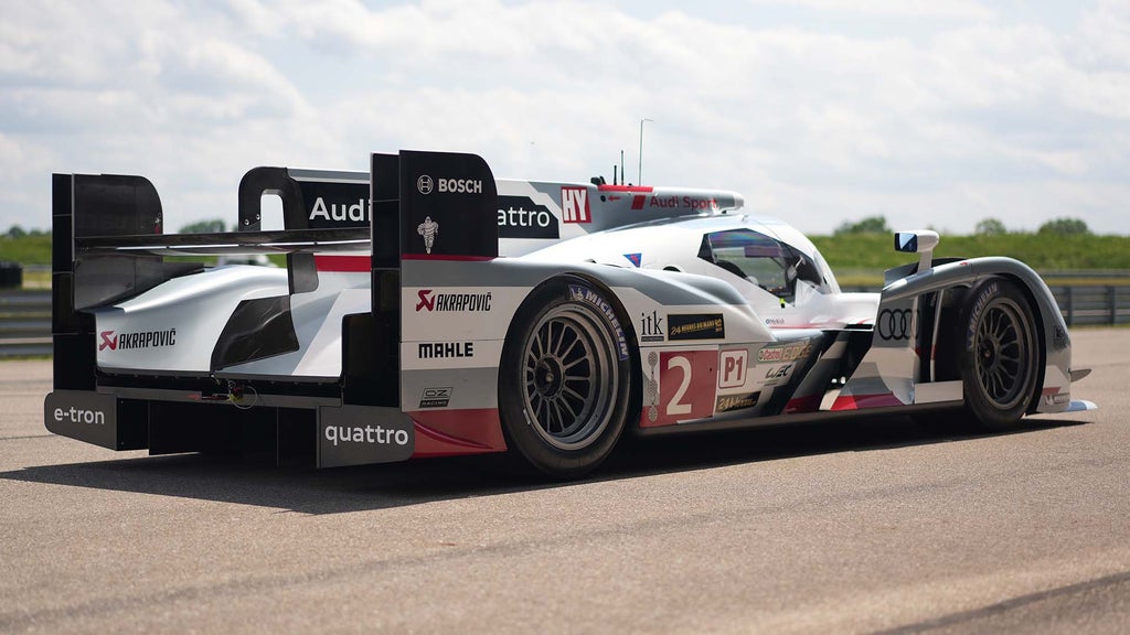 A picture showing an Audi R18 e-tron quattro race car on display in Neuburg.
