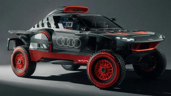 Audi off-road electric racing car with red rims on a grey background