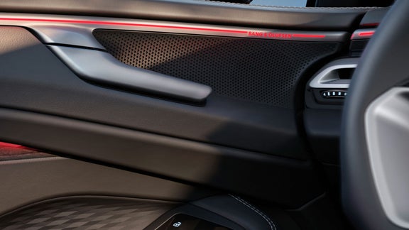Close up of an Audi car door interior with emphasis to the sound details