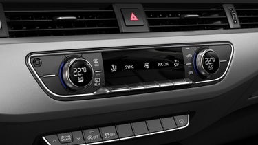 Car climate control panel with digital temperature display set to 22 degrees Celsius.