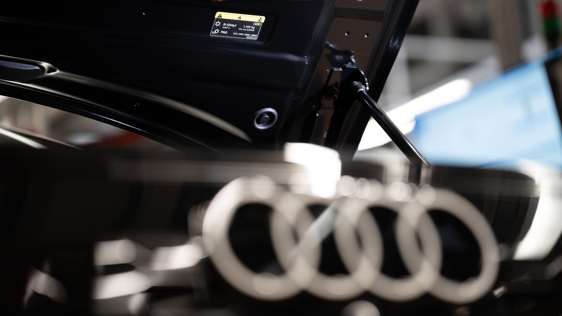 Label with technical data on the inside of the open bonnet in the production hall.