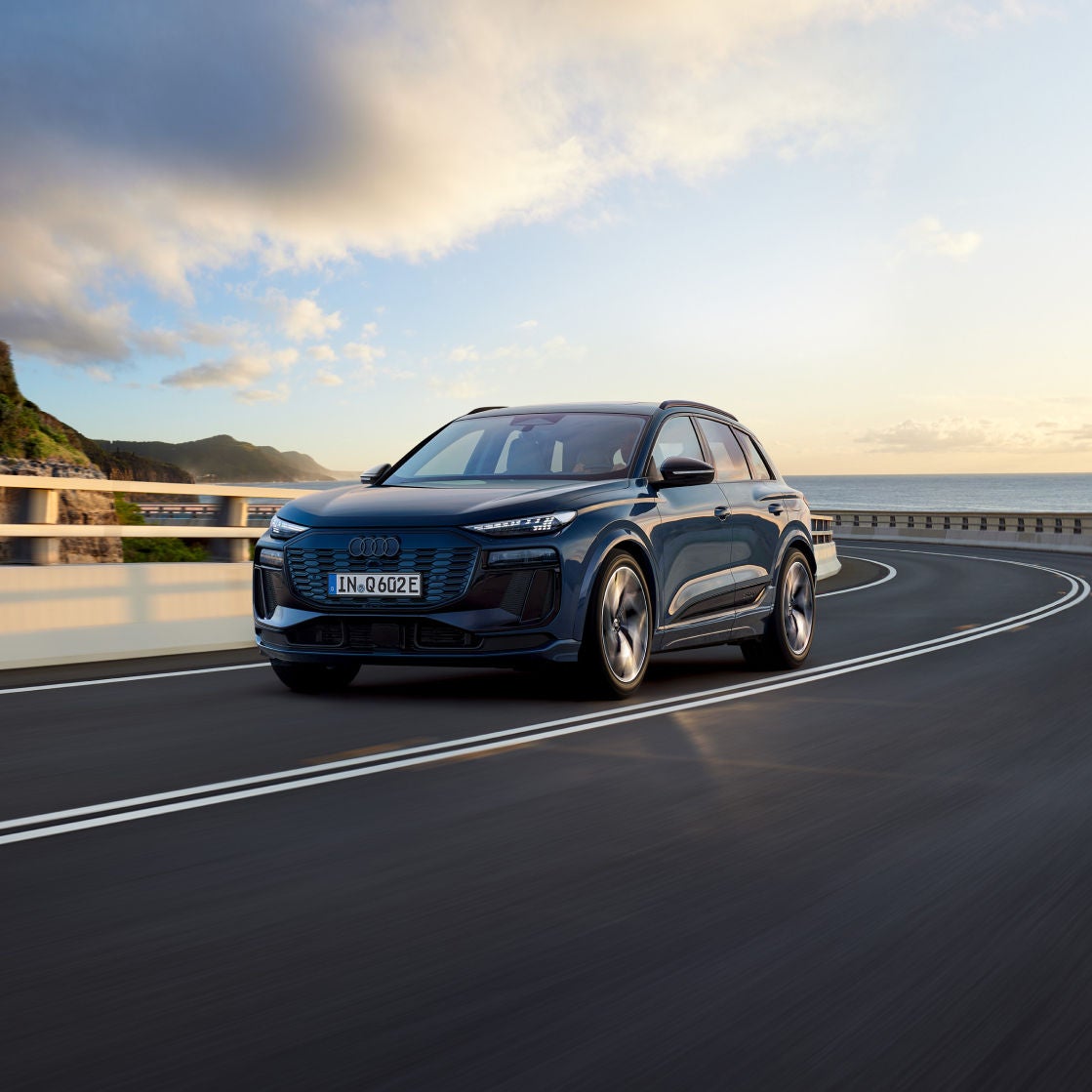 Dark Audi Q6 e-tron in an open road