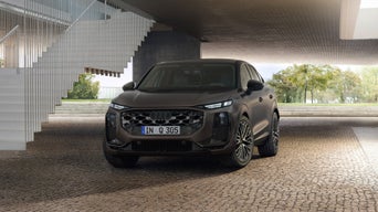 An Audi Q3 Sportback parked next to outside stairs