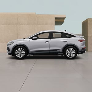 Left side of a white Q4 Sportback e-tron Audi vehicle