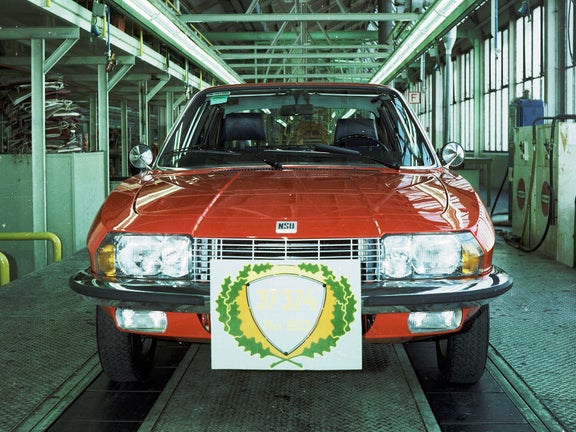 Photo of a red NSU Ro80 in a production facility