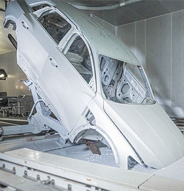 Car scaffolding is dipped in paint