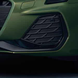 Green Audi A3 Sportback front bumper with black grille and air vent.