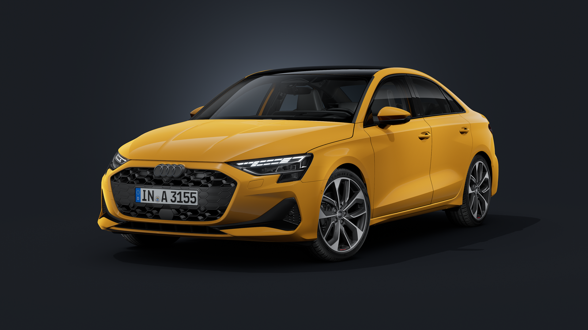 The Audi A3 Saloon, featuring an Audi exclusive custom paint finish in Vegas Yellow, seen from an oblique front angle against a dark background.