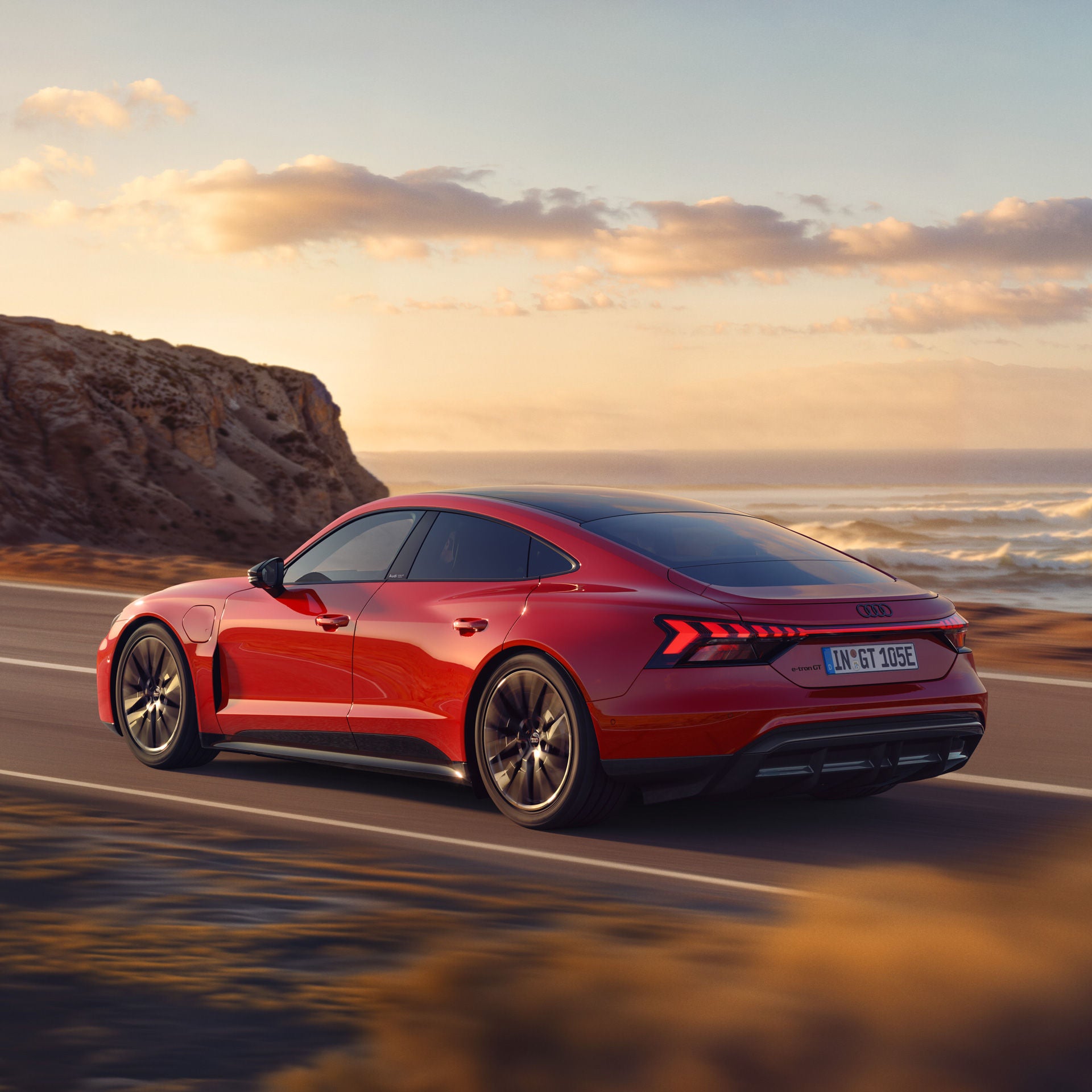 Audi RS e-tron GT on a coastal road.