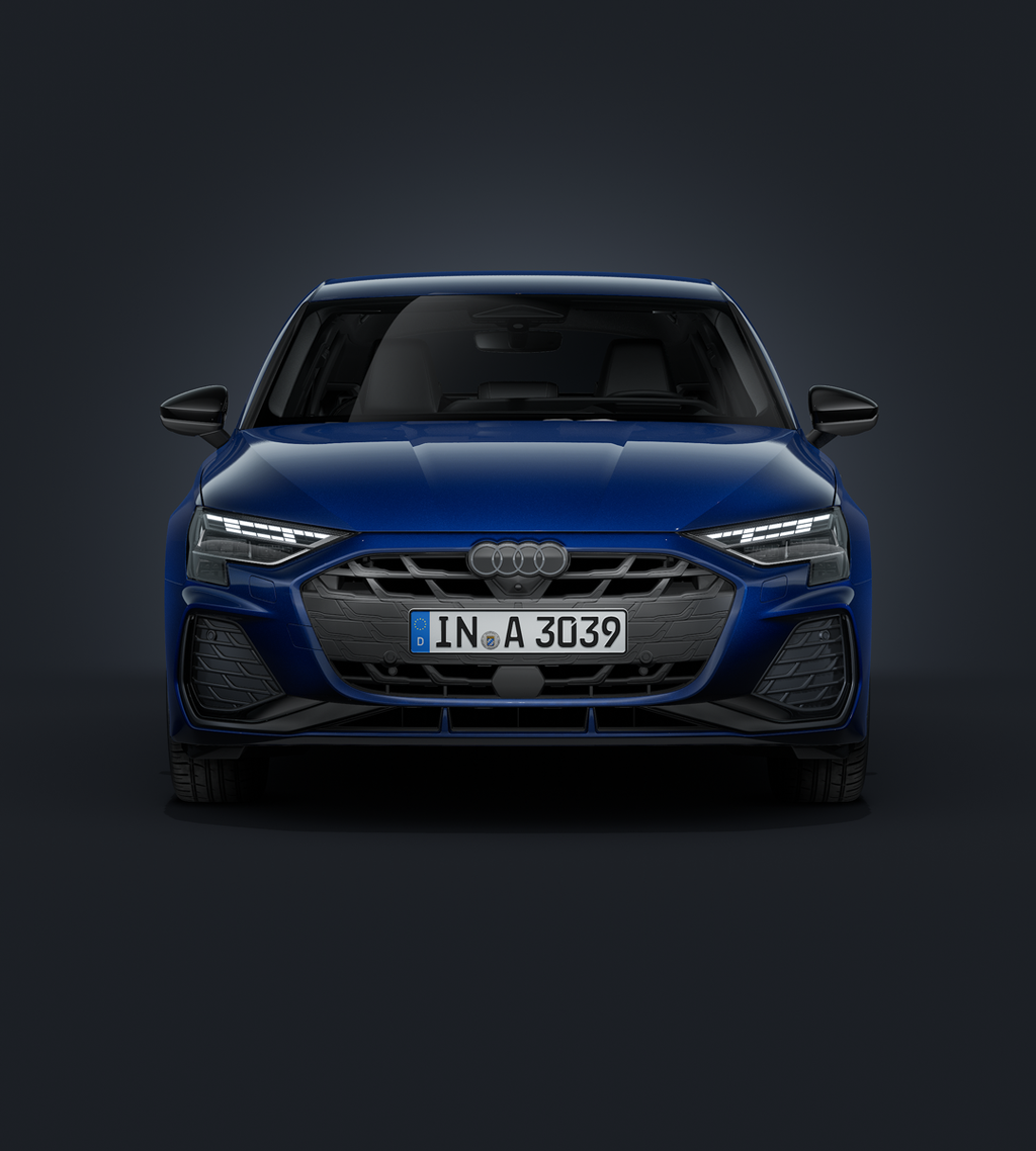 Der Audi A3 Sportback frontal von vorne auf dunklem Hintergrund.