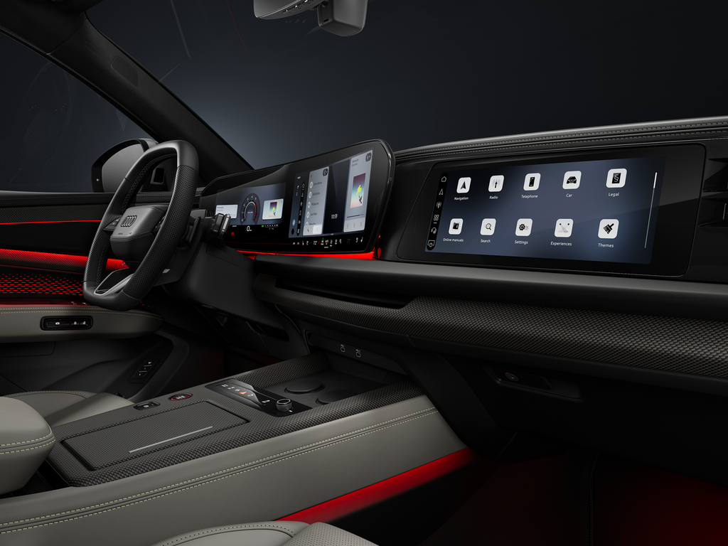 View from the passenger side of the cockpit, showing the steering wheel and the digital displays.