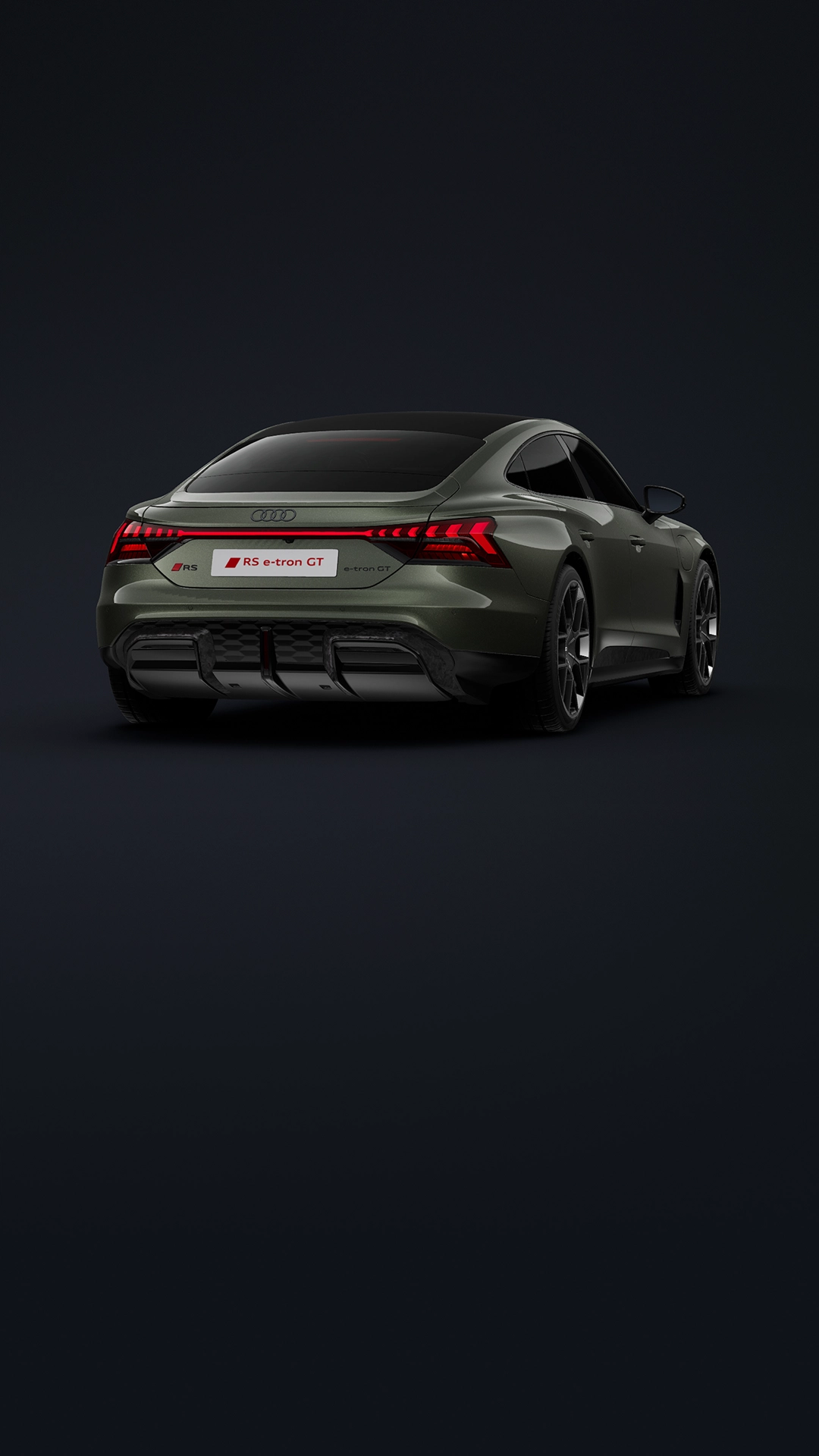 A green Audi electric sedan parked with a cityscape in the background. 
