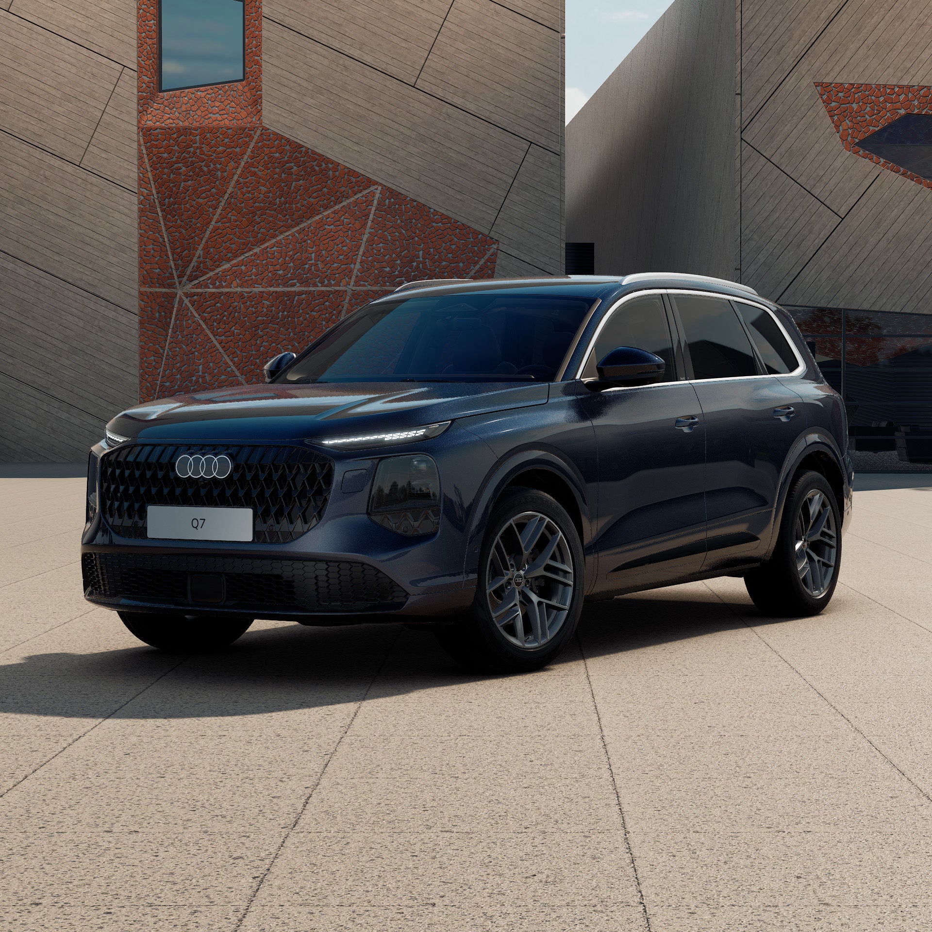 Ein Audi Q7 SUV in Waitomoblau Metallic schräg von vorne fotografiert vor einer futuristischen Kulisse