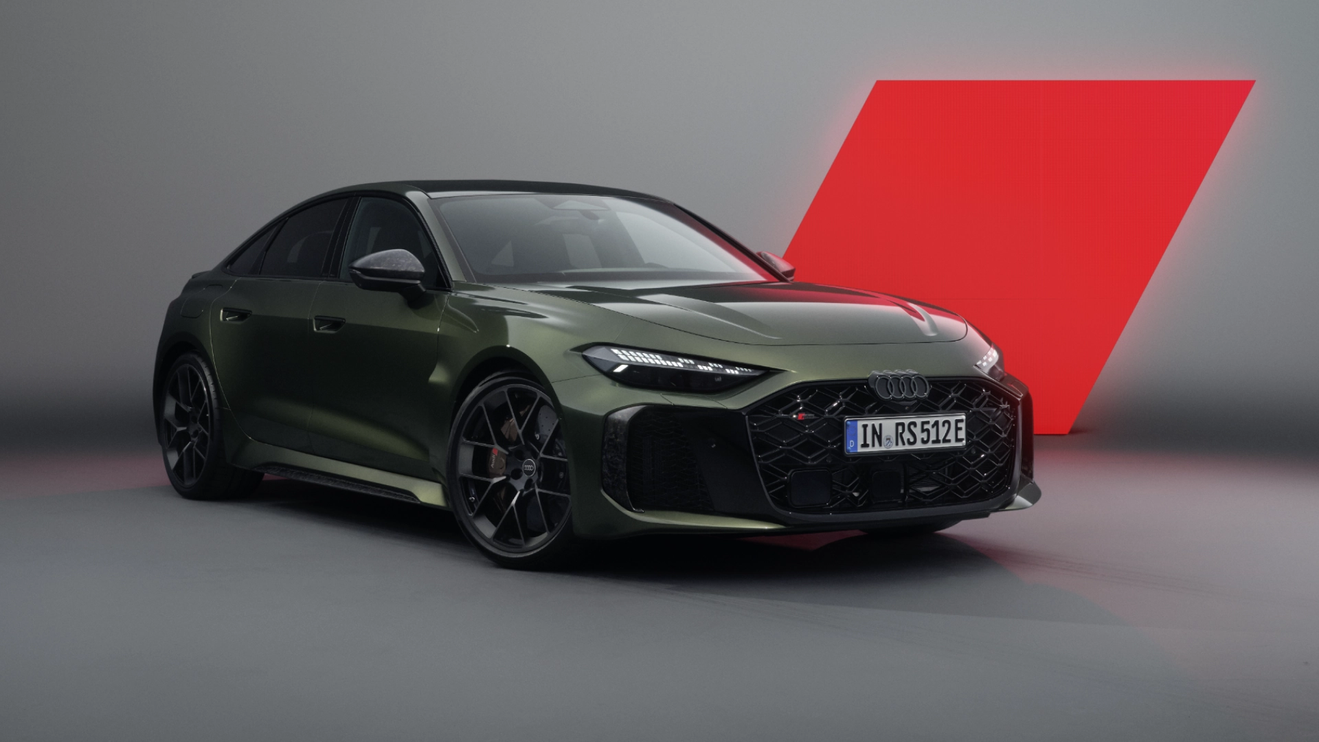 Audi RS 5 Saloon in green in a grey photography studio