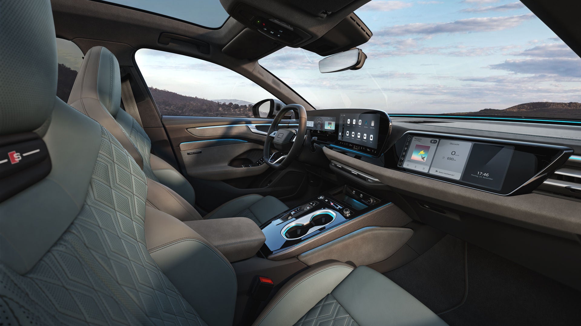 View through the passenger window into the cockpit of the A6 Avant. The interior has mint gray upholstery.