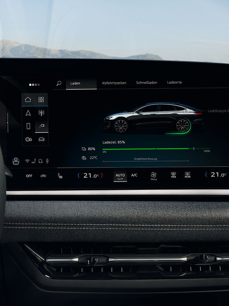 Ladeanzeige im Infotainmentsystem eines Audi A6 Sportback e-tron mit 85 % Ladeziel und Temperaturanzeige.