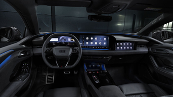 Interior of an Audi car with steering wheel and digital dashboard in view